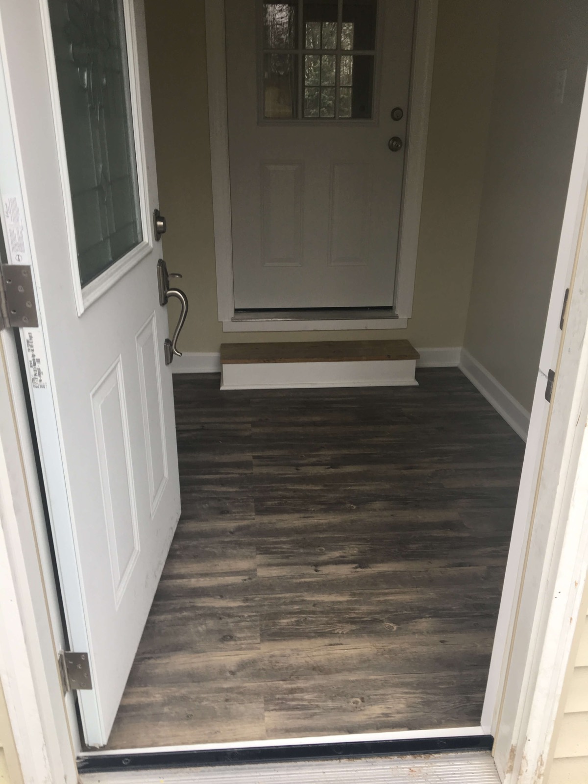 New door and luxury vinyl plank flooring installation