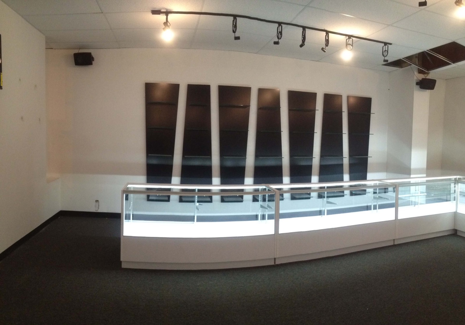 Commercial retail interior build-out with display cases and track lighting