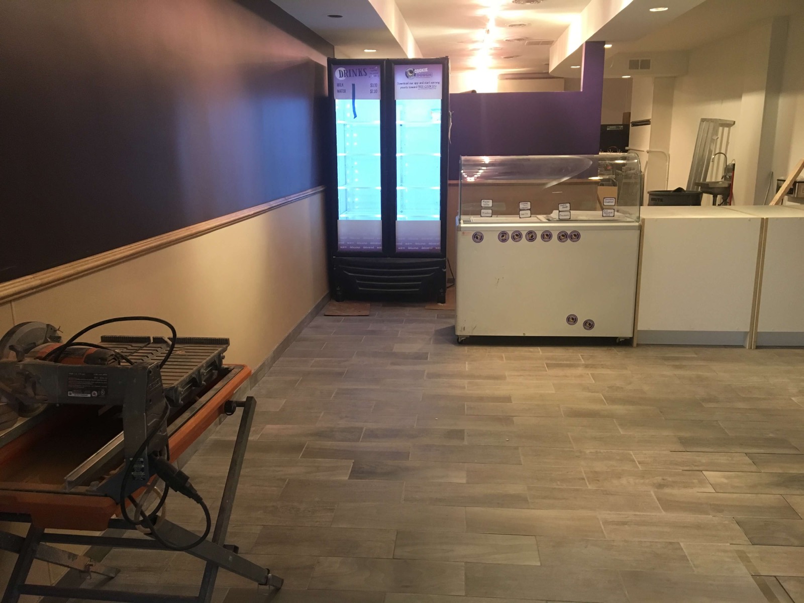 Commercial food-shop build-out with tile floor and display cases