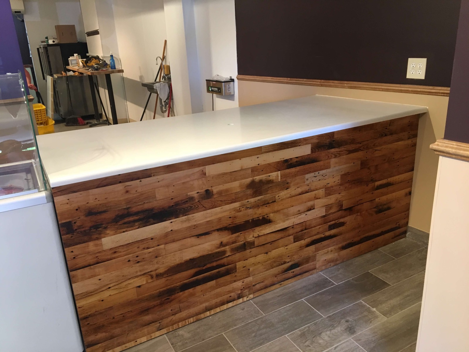 Custom reclaimed-wood counter with white poured top