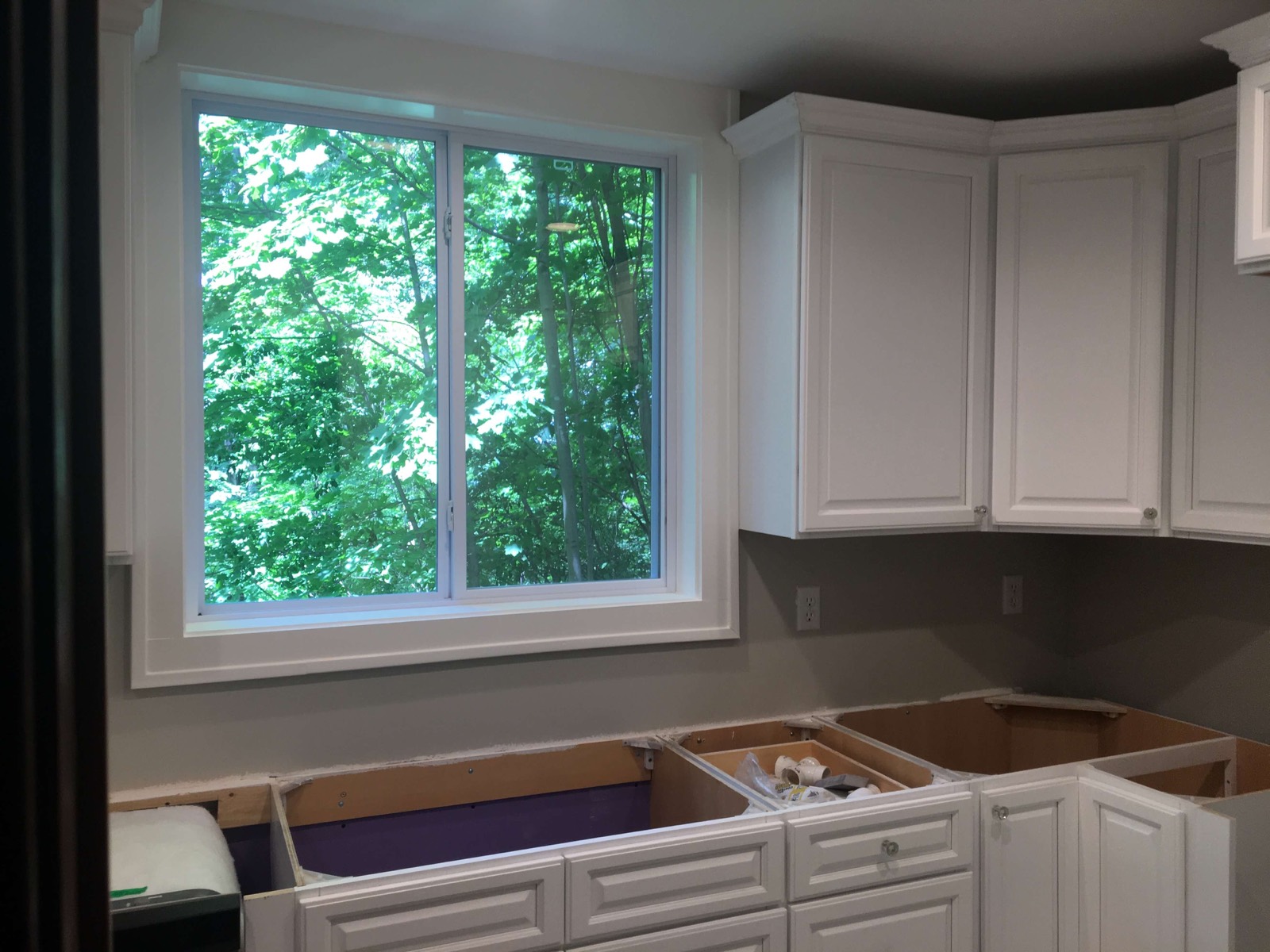 Kitchen remodel with new white cabinetry
